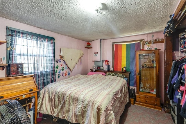 carpeted bedroom with a textured ceiling