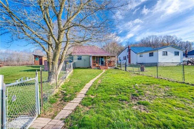 view of yard featuring a fenced backyard and a gate