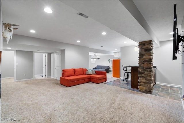 living room with carpet floors, recessed lighting, and visible vents