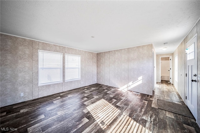 53 Martha Dr, Madison, OH 44057 - spare room with wood finished floors and a textured ceiling