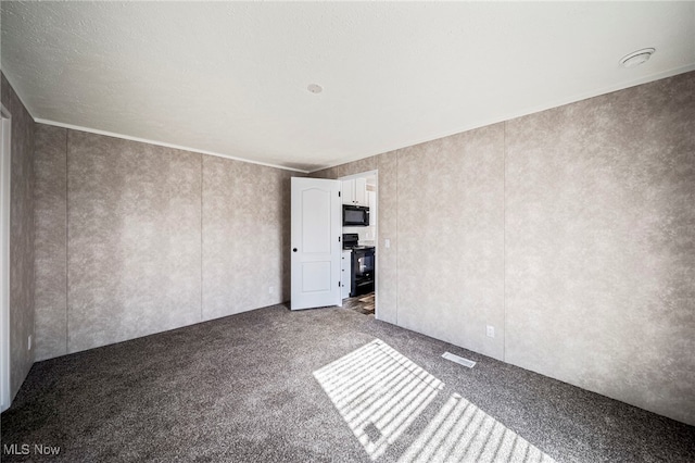 53 Martha Dr, Madison, OH 44057 - unfurnished room featuring dark colored carpet and visible vents