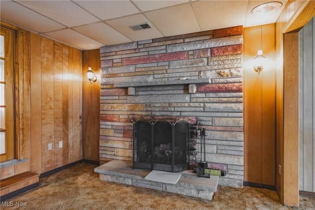 304 Conger Rd, Washington, WV 26181 - interior details featuring wood walls, a stone fireplace, carpet, and visible vents