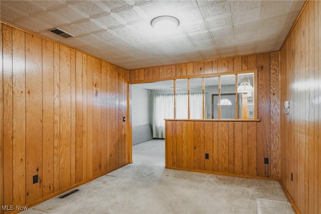 304 Conger Rd, Washington, WV 26181 - carpeted empty room featuring visible vents and wood walls
