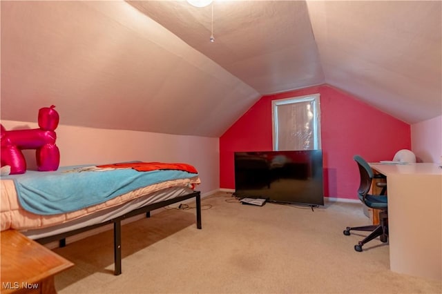 carpeted bedroom with baseboards and vaulted ceiling