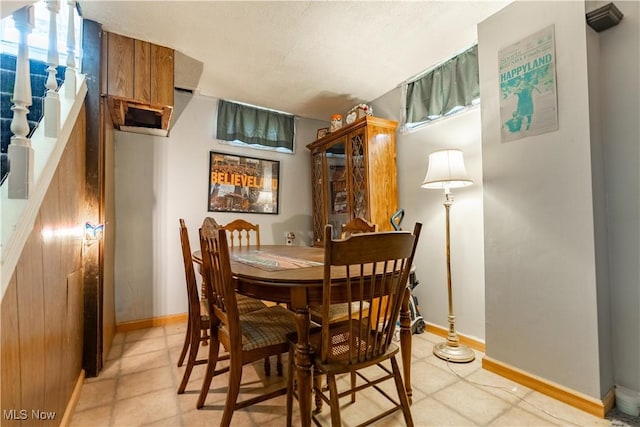 dining space featuring baseboards