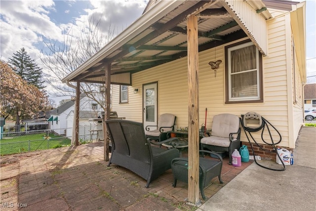 view of patio / terrace featuring fence