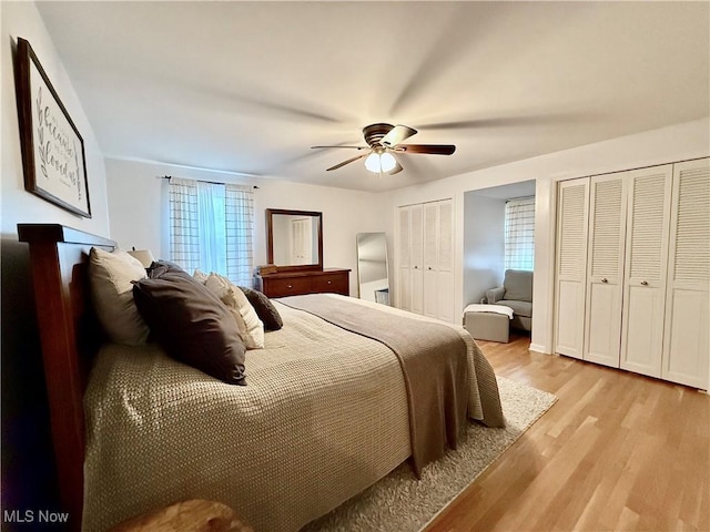 21 Ashwood Dr, Vienna, WV 26105 - bedroom featuring light wood-style floors, multiple closets, and ceiling fan