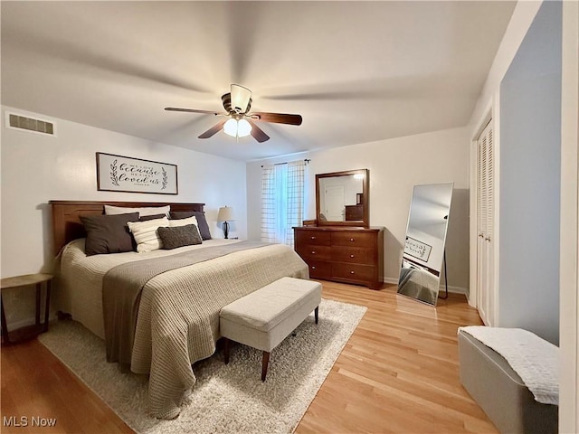 21 Ashwood Dr, Vienna, WV 26105 - bedroom with light wood-type flooring, ceiling fan, and baseboards