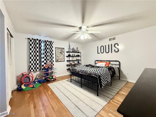21 Ashwood Dr, Vienna, WV 26105 - bedroom featuring wood finished floors, a ceiling fan, a closet, and baseboards