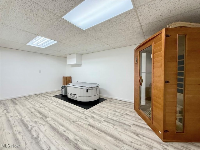 21 Ashwood Dr, Vienna, WV 26105 - unfurnished room with a drop ceiling, wood finished floors, a sauna, and baseboards