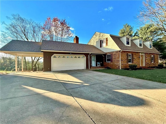 21 Ashwood Dr, Vienna, WV 26105 - view of front of home with driveway, an attached garage, brick siding, and a chimney