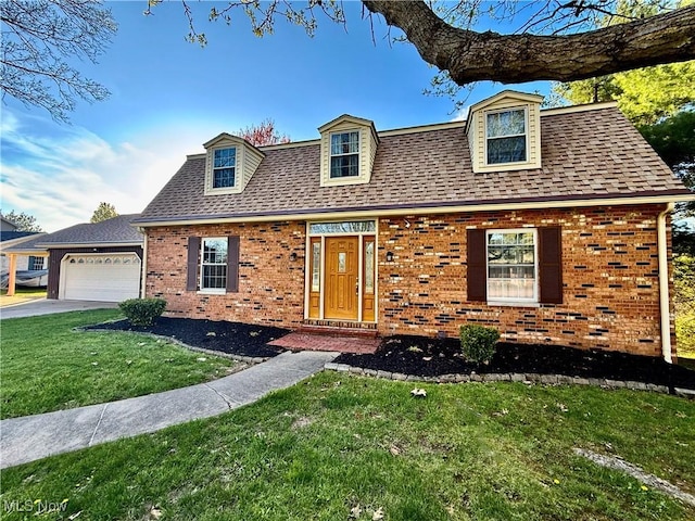 21 Ashwood Dr, Vienna, WV 26105 - view of front of home featuring brick siding, a front yard, roof with shingles, an attached garage, and concrete driveway