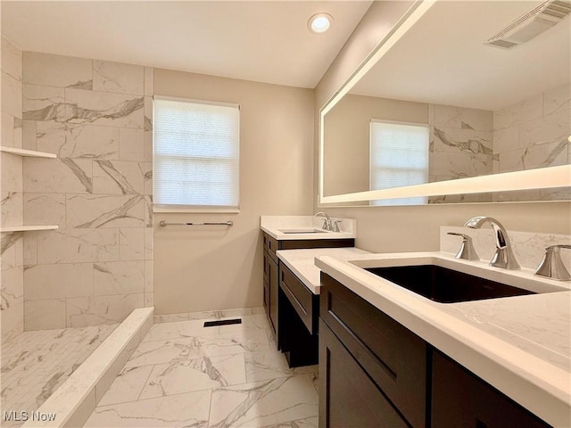 21 Ashwood Dr, Vienna, WV 26105 - full bathroom with marble finish flooring, two vanities, baseboards, a walk in shower, and recessed lighting