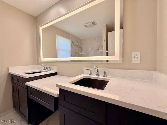 21 Ashwood Dr, Vienna, WV 26105 - full bath featuring two vanities, marble look tiles, and a shower