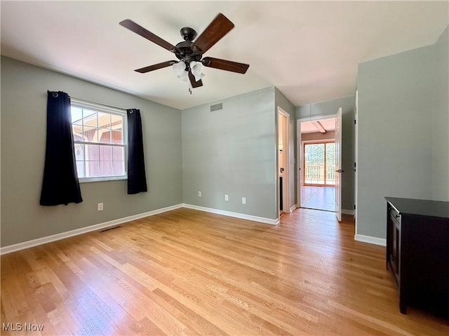 21 Ashwood Dr, Vienna, WV 26105 - spare room with a ceiling fan, light wood finished floors, and baseboards