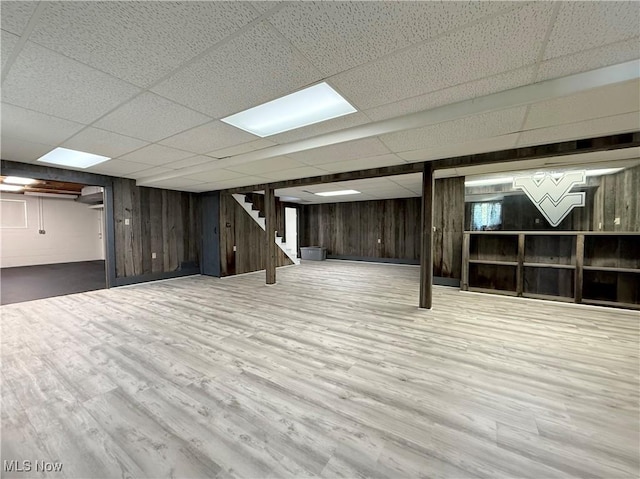 21 Ashwood Dr, Vienna, WV 26105 - finished basement with a paneled ceiling, wood finished floors, stairs, and wooden walls