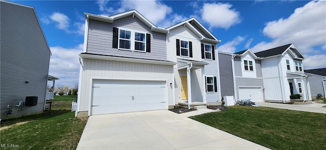traditional home with an attached garage, driveway, and a front lawn