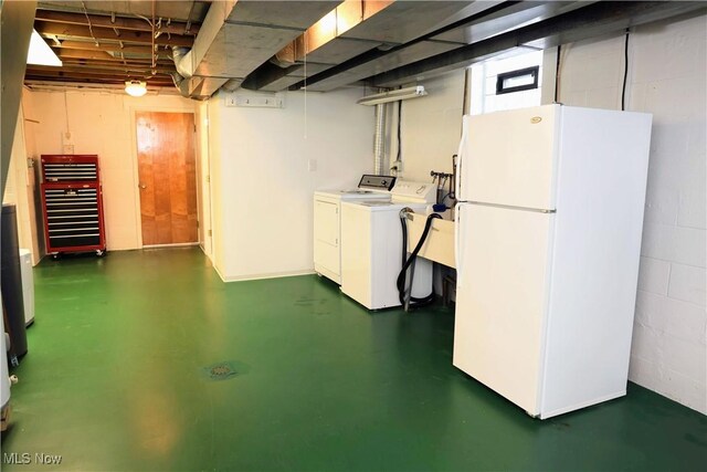 126 Vine St, Mingo Junction, OH 43938 - basement with washer and clothes dryer, freestanding refrigerator, and concrete block wall