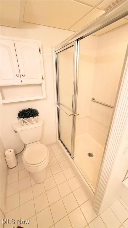 126 Vine St, Mingo Junction, OH 43938 - bathroom featuring a shower stall, tile patterned flooring, and toilet