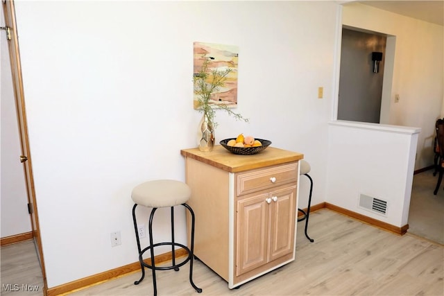 126 Vine St, Mingo Junction, OH 43938 - corridor featuring visible vents, baseboards, and light wood-type flooring