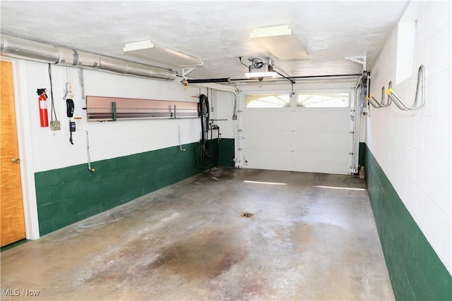 126 Vine St, Mingo Junction, OH 43938 - garage with concrete block wall and a garage door opener