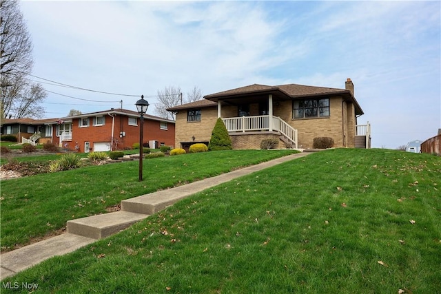 126 Vine St, Mingo Junction, OH 43938 - view of front of house with a chimney, covered porch, a front yard, and brick siding