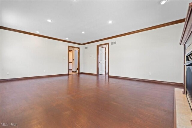 5215 Glenbrook Dr, Vienna, WV 26105 - unfurnished living room with ornamental molding, visible vents, recessed lighting, wood finished floors, and baseboards