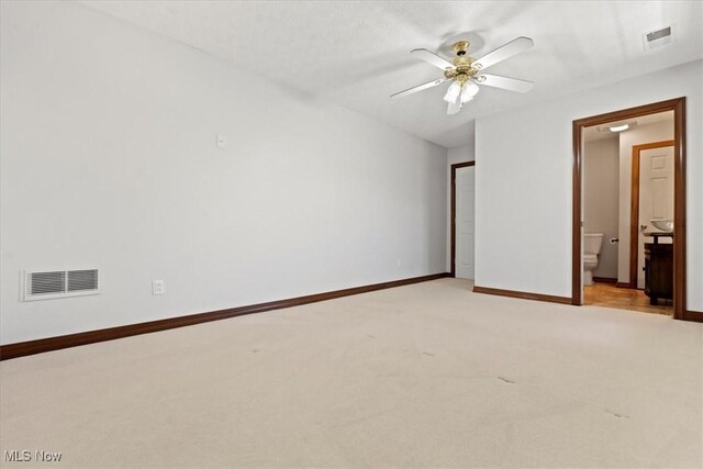 5215 Glenbrook Dr, Vienna, WV 26105 - unfurnished bedroom featuring visible vents, baseboards, light carpet, and connected bathroom