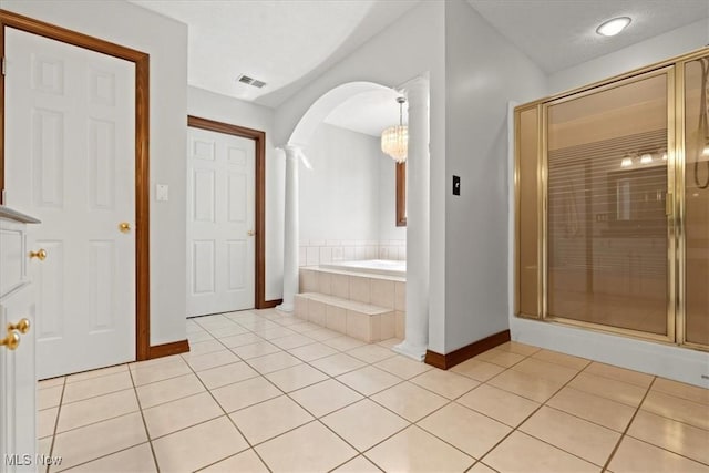 5215 Glenbrook Dr, Vienna, WV 26105 - bathroom with a shower stall, baseboards, tile patterned flooring, visible vents, and ornate columns
