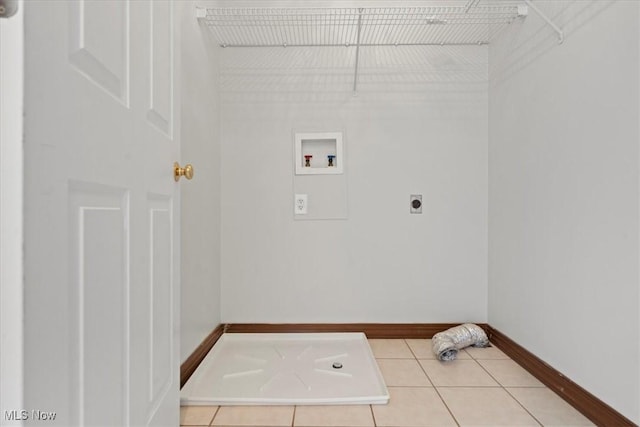 5215 Glenbrook Dr, Vienna, WV 26105 - laundry area featuring tile patterned floors, baseboards, hookup for a washing machine, electric dryer hookup, and laundry area