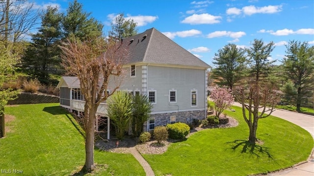 5215 Glenbrook Dr, Vienna, WV 26105 - view of property exterior with a yard, a shingled roof, and stone siding