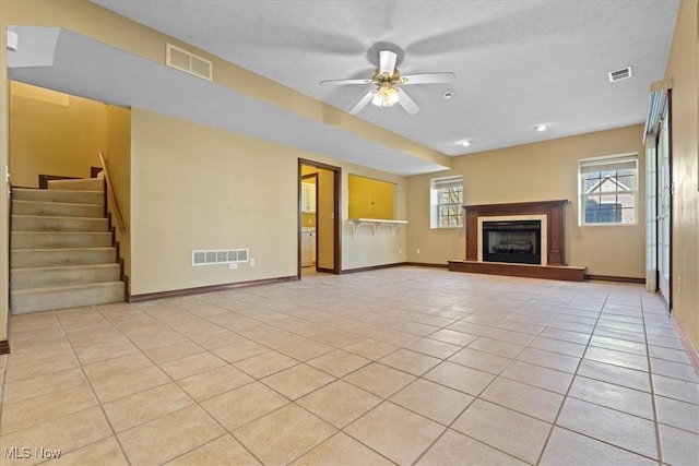 5215 Glenbrook Dr, Vienna, WV 26105 - unfurnished living room featuring light tile patterned flooring, stairway, visible vents, and baseboards