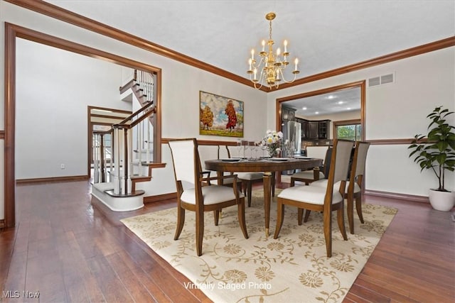 5215 Glenbrook Dr, Vienna, WV 26105 - dining space featuring visible vents, a notable chandelier, stairway, and wood-type flooring