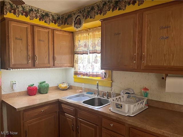 152 Regent St, Youngstown, OH 44507 - kitchen with brown cabinets, light countertops, and a sink