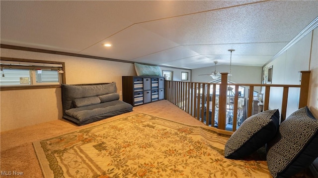 living area featuring lofted ceiling, a ceiling fan, carpet flooring, and crown molding