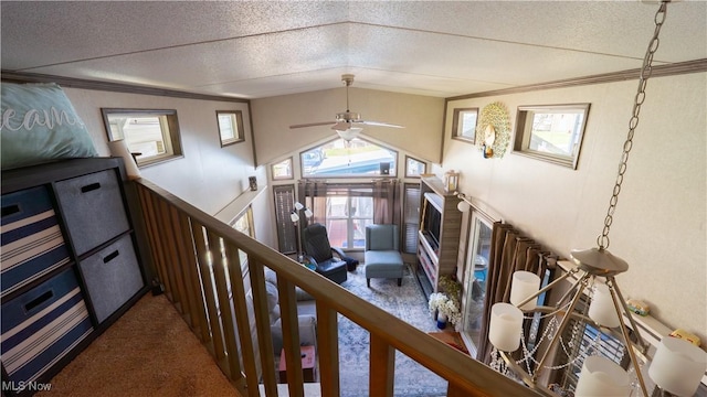 hallway with crown molding, a wealth of natural light, carpet, and lofted ceiling