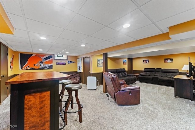carpeted living room with a paneled ceiling and recessed lighting
