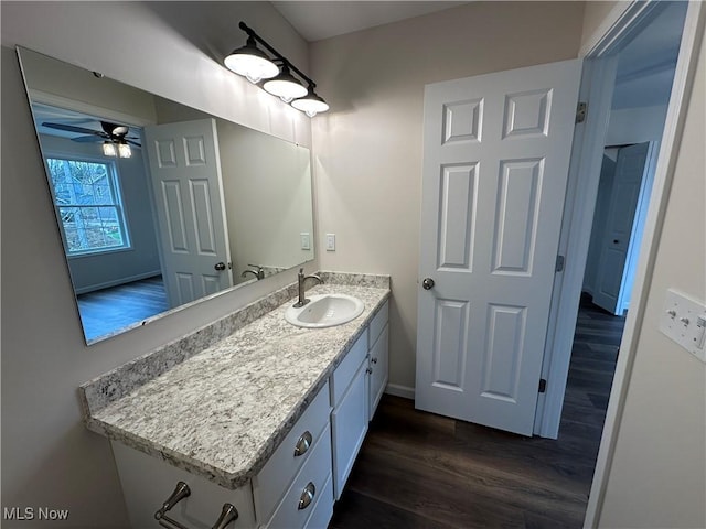 738 Mineral Springs Ave, Youngstown, OH 44511 - bathroom featuring wood finished floors, ceiling fan, vanity, and baseboards