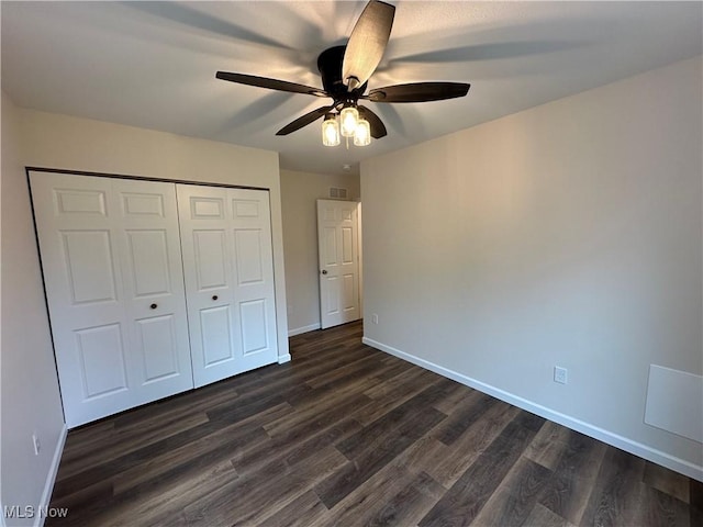 738 Mineral Springs Ave, Youngstown, OH 44511 - unfurnished bedroom featuring dark wood-style floors, baseboards, and a closet
