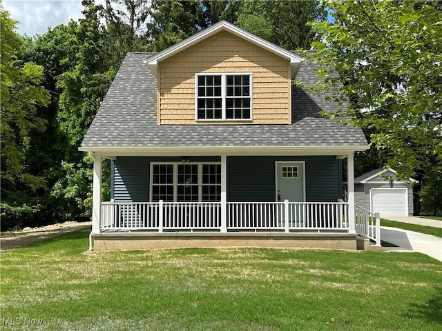 738 Mineral Springs Ave, Youngstown, OH 44511 - view of front of property featuring covered porch, an outbuilding, a front lawn, and a shingled roof