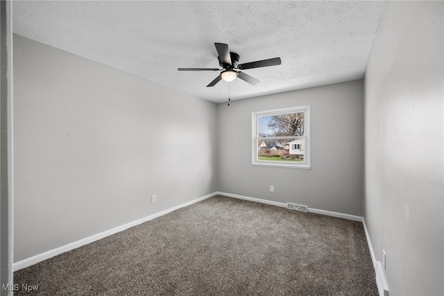 empty room with a textured ceiling, ceiling fan, baseboards, carpet flooring, and visible vents