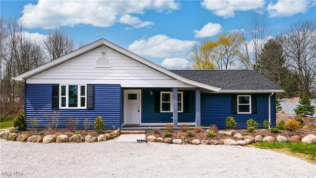 view of front of property featuring a porch and a shingled roof