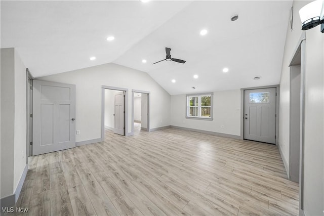 unfurnished living room featuring vaulted ceiling, ceiling fan, light wood-style flooring, baseboards, and recessed lighting