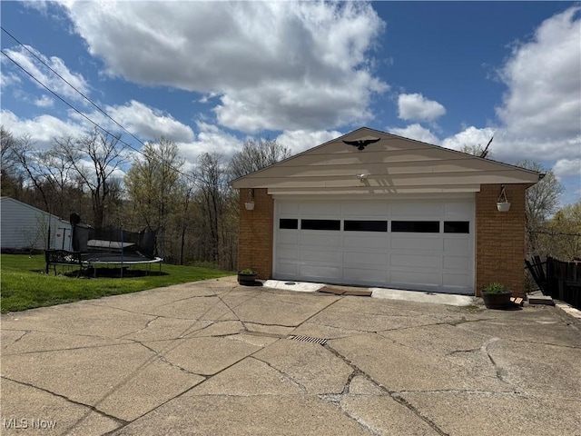detached garage featuring a trampoline