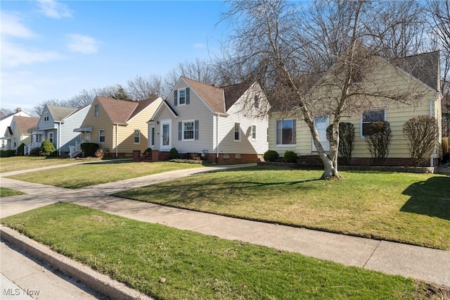 view of front facade with a front lawn and a residential view