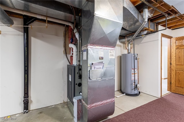 utility room featuring water heater