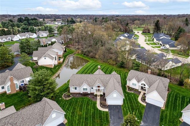 aerial view featuring a residential view and a water view