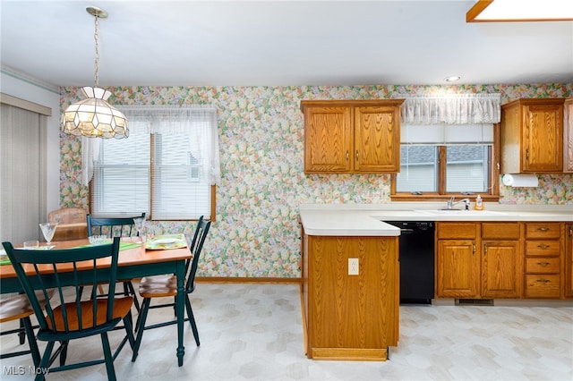 kitchen with brown cabinets, black dishwasher, and plenty of natural light
