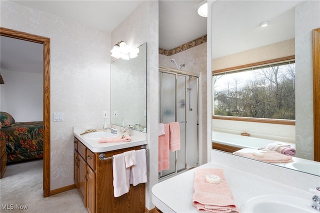 ensuite bathroom with wallpapered walls, a shower stall, vanity, connected bathroom, and a bath