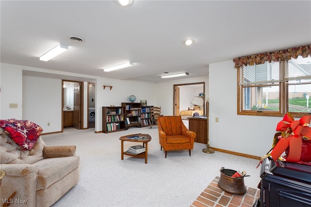 carpeted living room with visible vents and baseboards